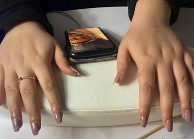 Freshly manicured nails at The Beauty Space, Hildenborough, England, GB on a white cushion.
