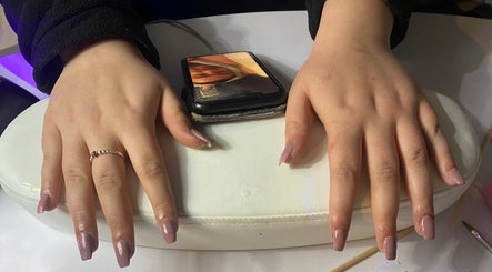 Freshly manicured nails at The Beauty Space, Hildenborough, England, GB on a white cushion.