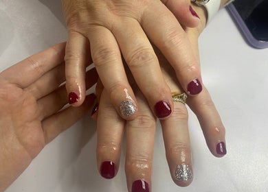 Red and silver manicure at The Beauty Space, Hildenborough, England, GB, showcasing elegant nail art.