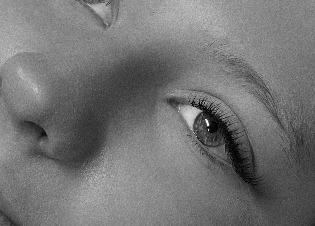 Close-up of a serene face at Aura Aesthetics Studio, Cessnock, AU, showcasing stunning lashes.