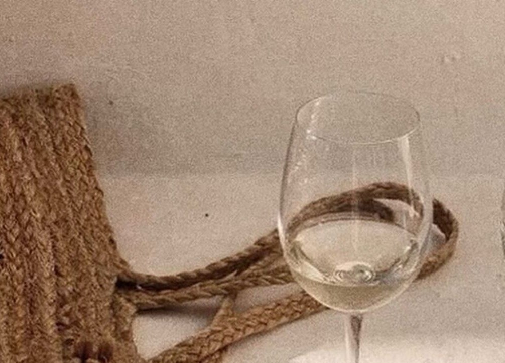 Elegant wine glasses on display at Aura Aesthetics Studio, Cessnock, AU, enhancing a cozy, sophisticated ambiance.