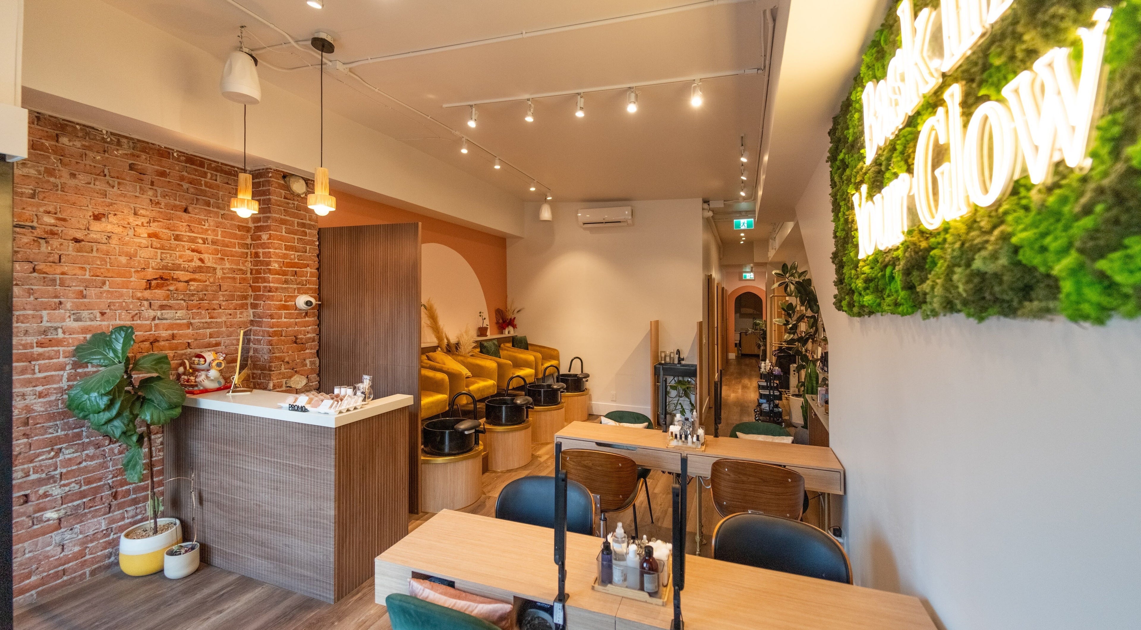 Inviting interior of Liveo Beauty in Vancouver, British Columbia, CA, featuring a rustic design and cozy seating.