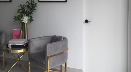 Elegant lounge area at Armelle Lashes, Liverpool, New South Wales, AU with plush seating and decor.