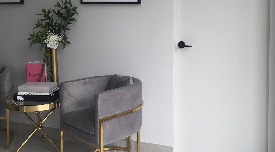 Elegant lounge area at Armelle Lashes, Liverpool, New South Wales, AU with plush seating and decor.