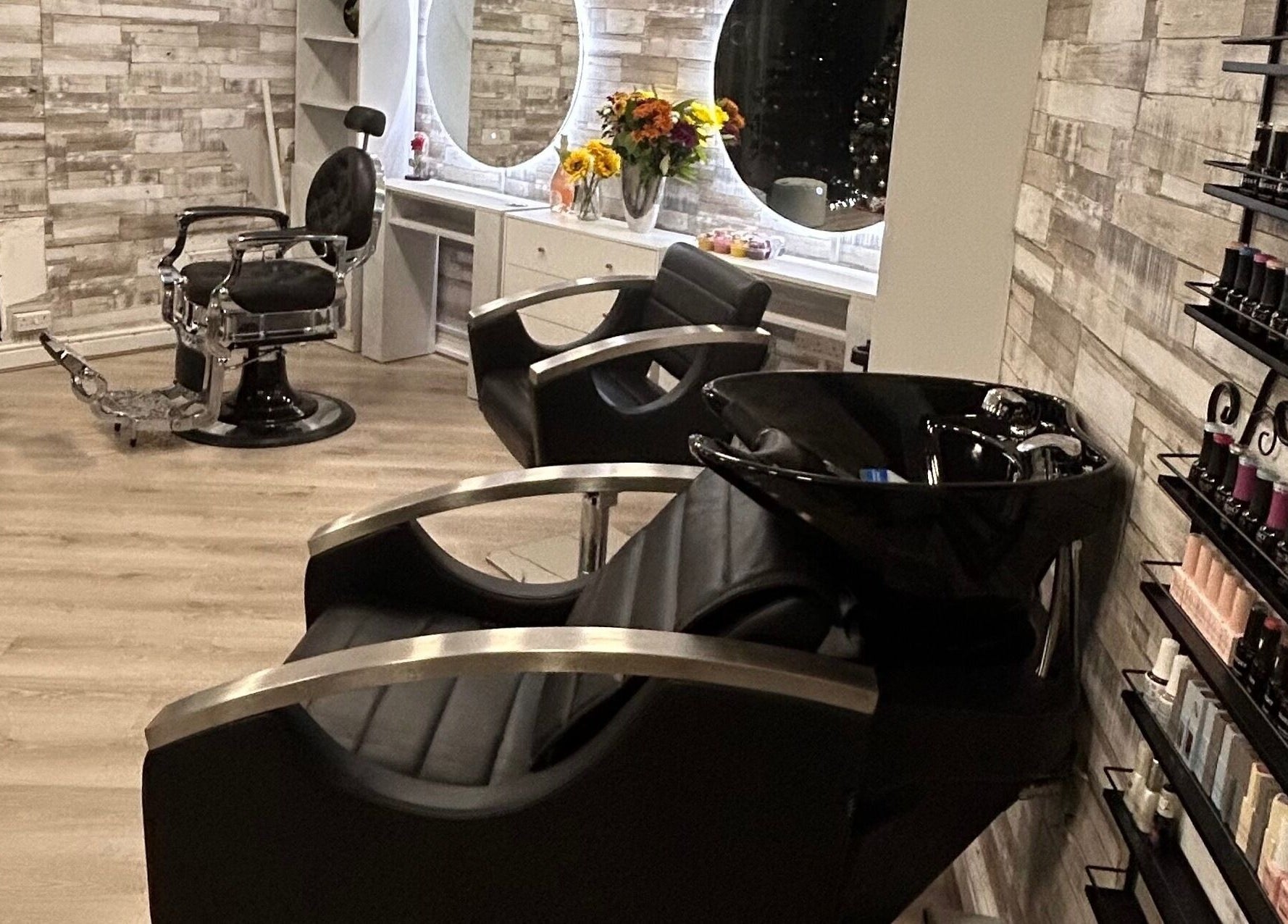 Chic interior of Daniela Beauty Salon in Wolverhampton, England, GB, featuring stylish chairs and nail polish display.