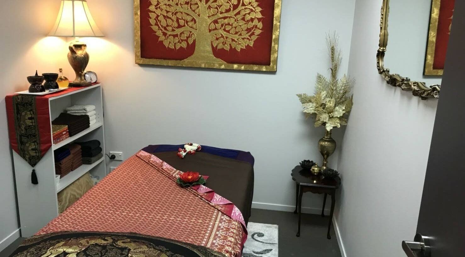 Tranquil massage room at Iyra Thai Massage - Rosedale, Auckland, Auckland, NZ with warm lighting and decor.