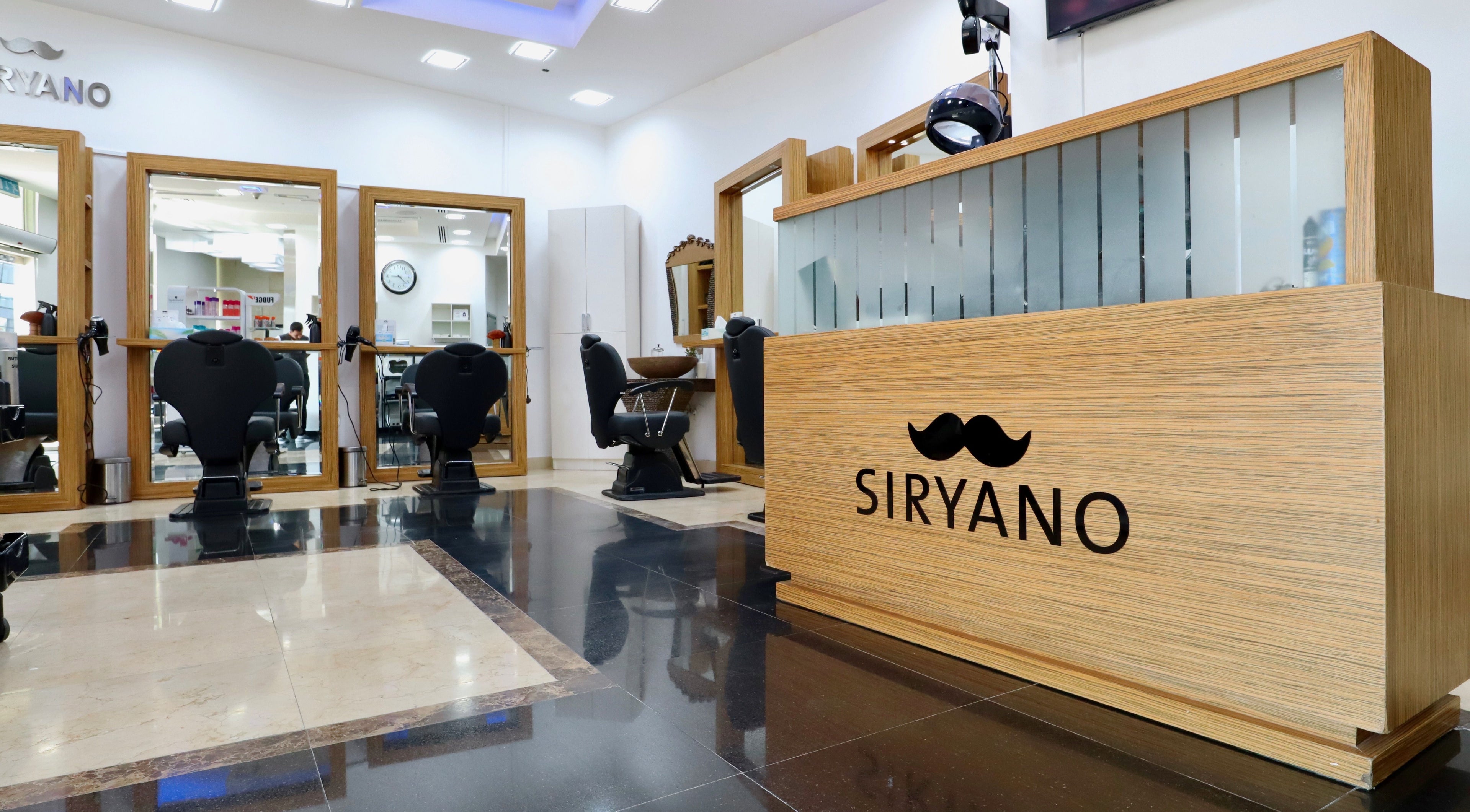 Siryano Gents Saloon and Spa, Escape Tower in Dubai, AE, showcasing a modern salon interior with styling chairs.