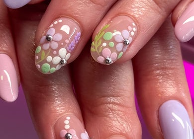 Floral nail art at Savage Nails, Auckland, Auckland, NZ featuring pastel designs and embellishments.