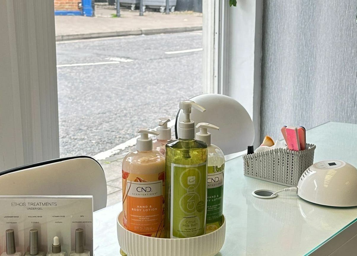 Modern nail station at Beauty Within | Stevenage, England, GB, showcasing lotions and manicure tools.