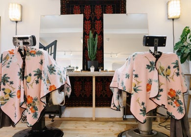 Chic salon chairs with floral covers at Courage Noble | King Street, Norwich, England, GB.