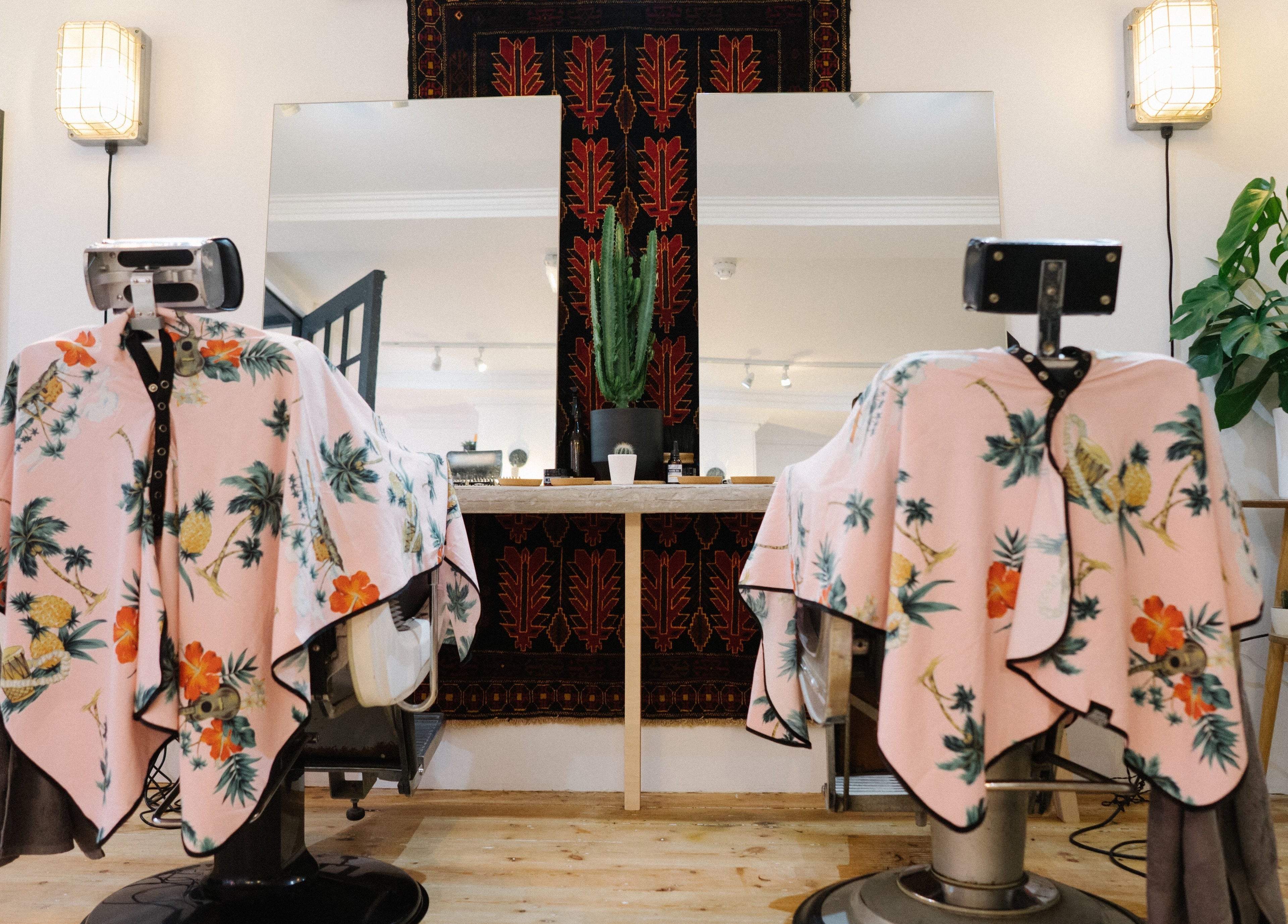 Chic salon chairs with floral covers at Courage Noble | King Street, Norwich, England, GB.