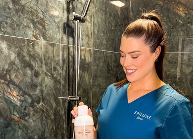 Epiluxe Clinic professional with product in a marble shower, Castlerea, Co. Roscommon, IE.