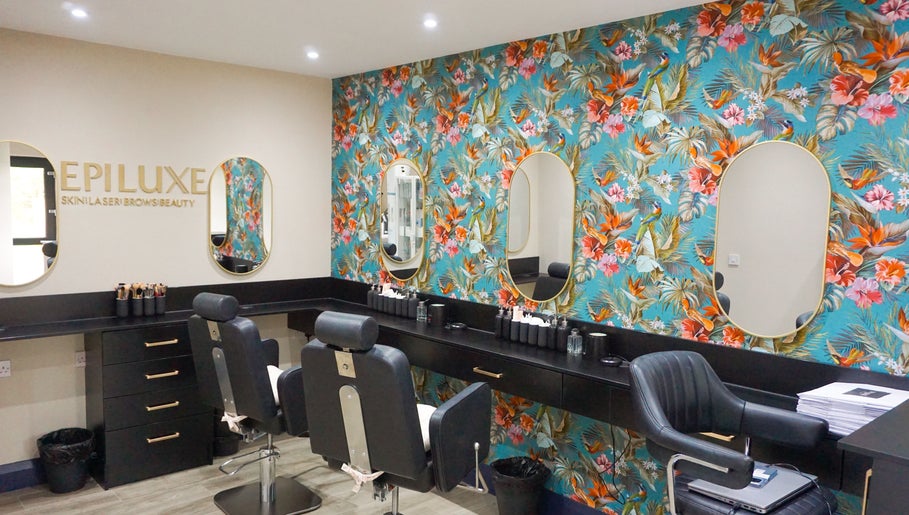 Epiluxe Clinic in Castlerea, Co. Roscommon, IE featuring a vibrant floral wall and modern beauty chairs.