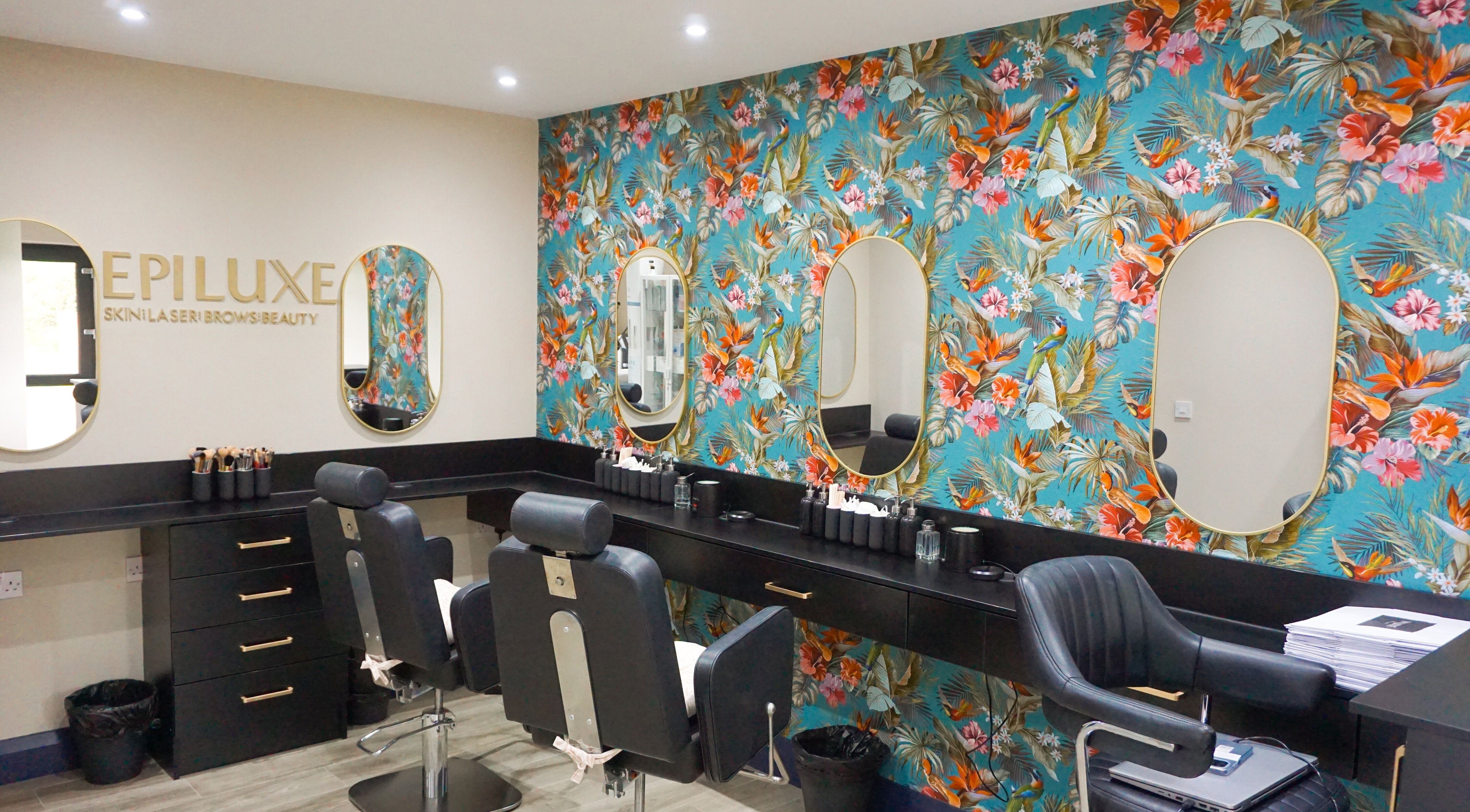 Epiluxe Clinic in Castlerea, Co. Roscommon, IE featuring a vibrant floral wall and modern beauty chairs.