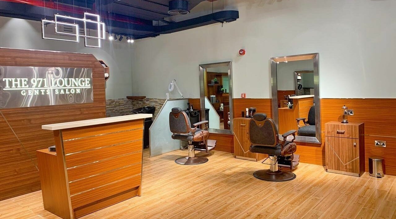 Modern interior of The 971 Lounge Gents Salon in Dubai, AE featuring stylish barber chairs and decor.