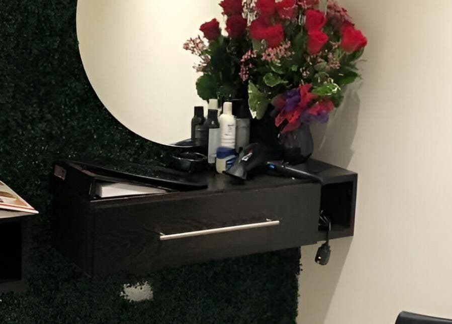 Vanity with floral decor at Milaya Salon & Medical Spa, Port of Spain, TT. Inviting beauty space.