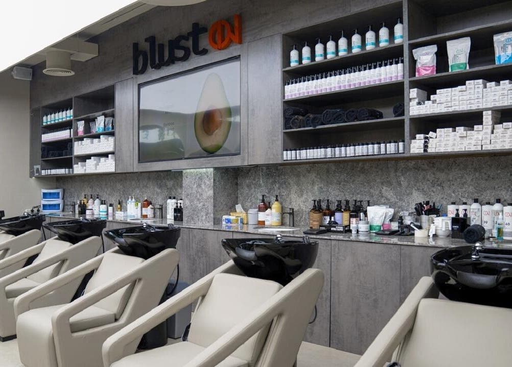 Victor Keyrouz X Amaraya offers a sleek salon interior in Dubai, AE with luxury shampoo chairs and products.