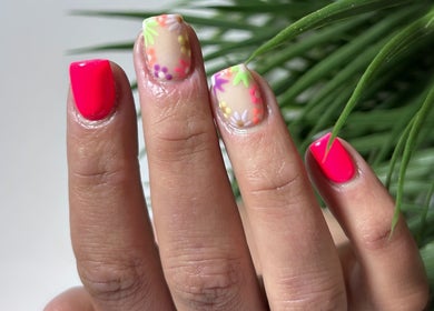 Bright floral and neon nails at Snatched Cosmetics, Boksburg, Gauteng, ZA, highlighting unique nail art designs.