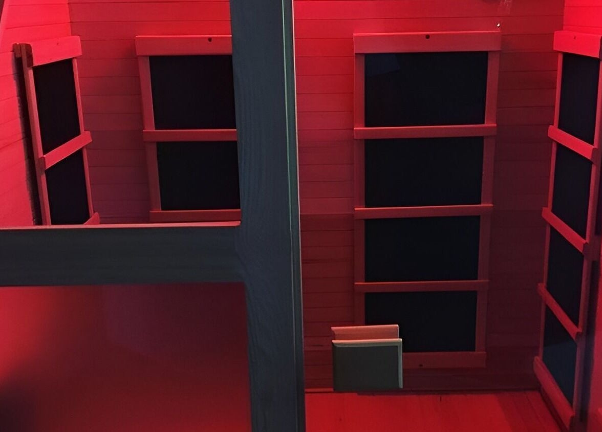 Interior of SWET Infrared Sauna Studio - Forest Hills in Grand Rapids, Michigan, US with calming red lights.