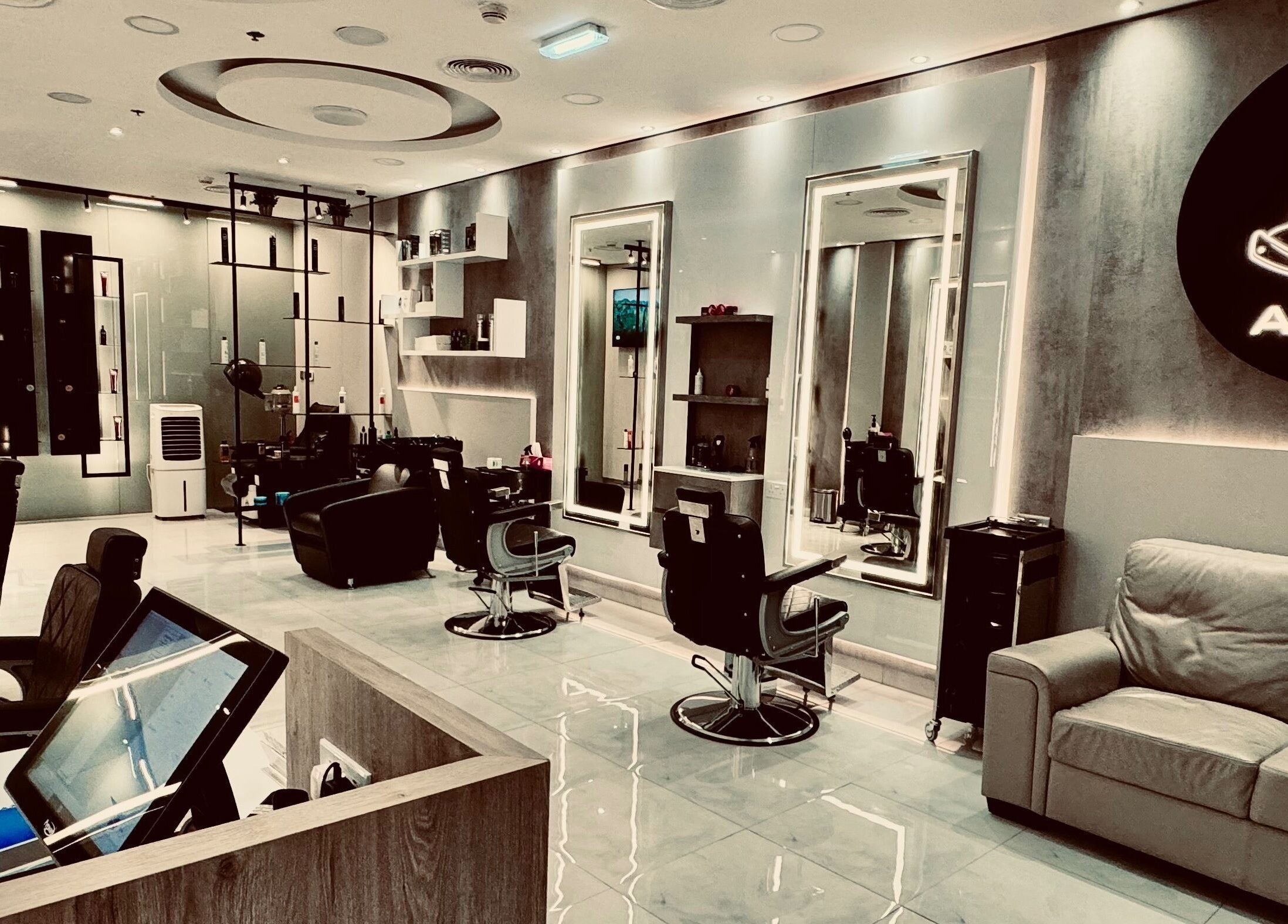 Elegant interior of Aleph Gents Salon DMCC in Dubai, AE featuring sleek chairs and modern decor.