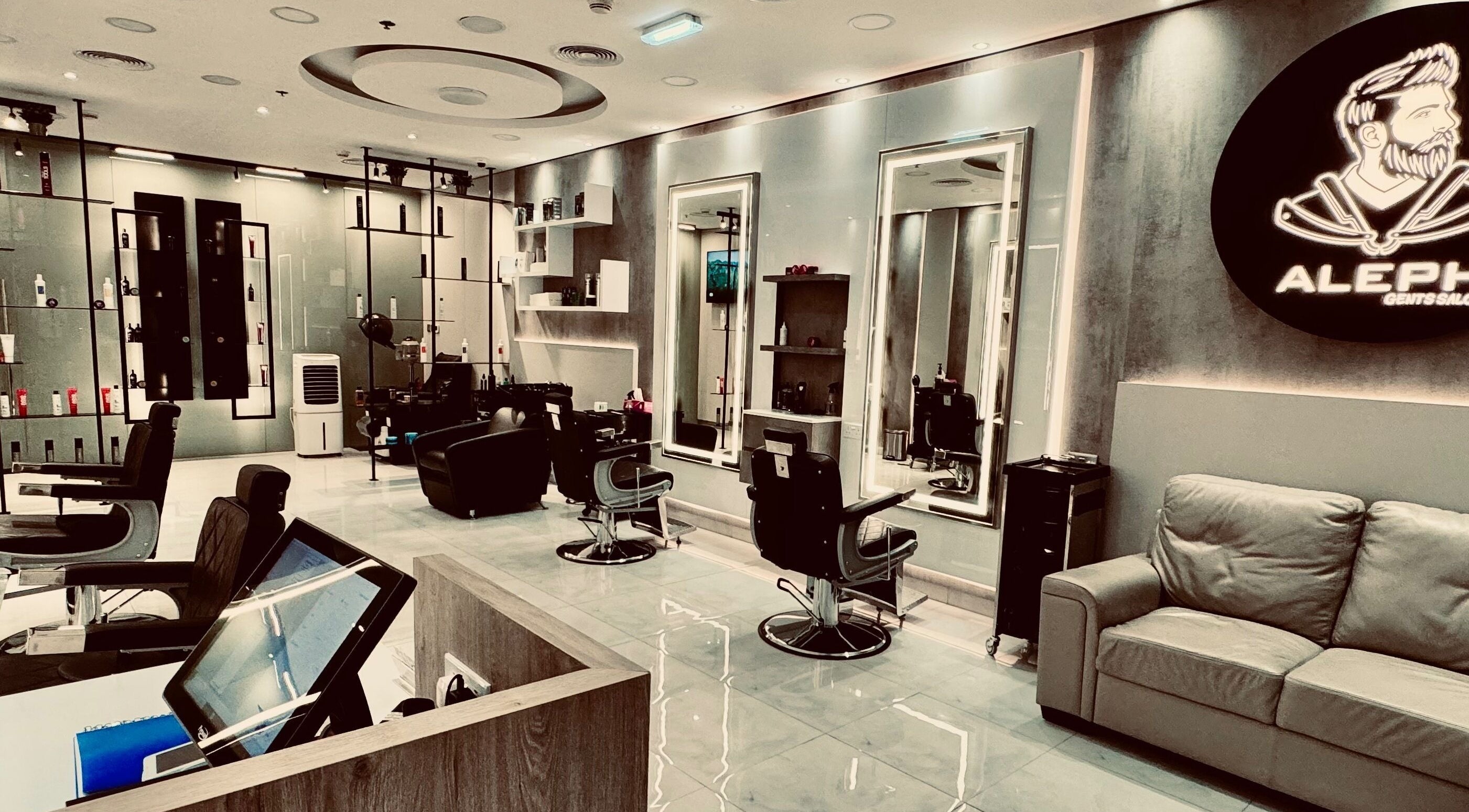 Elegant interior of Aleph Gents Salon DMCC in Dubai, AE featuring sleek chairs and modern decor.