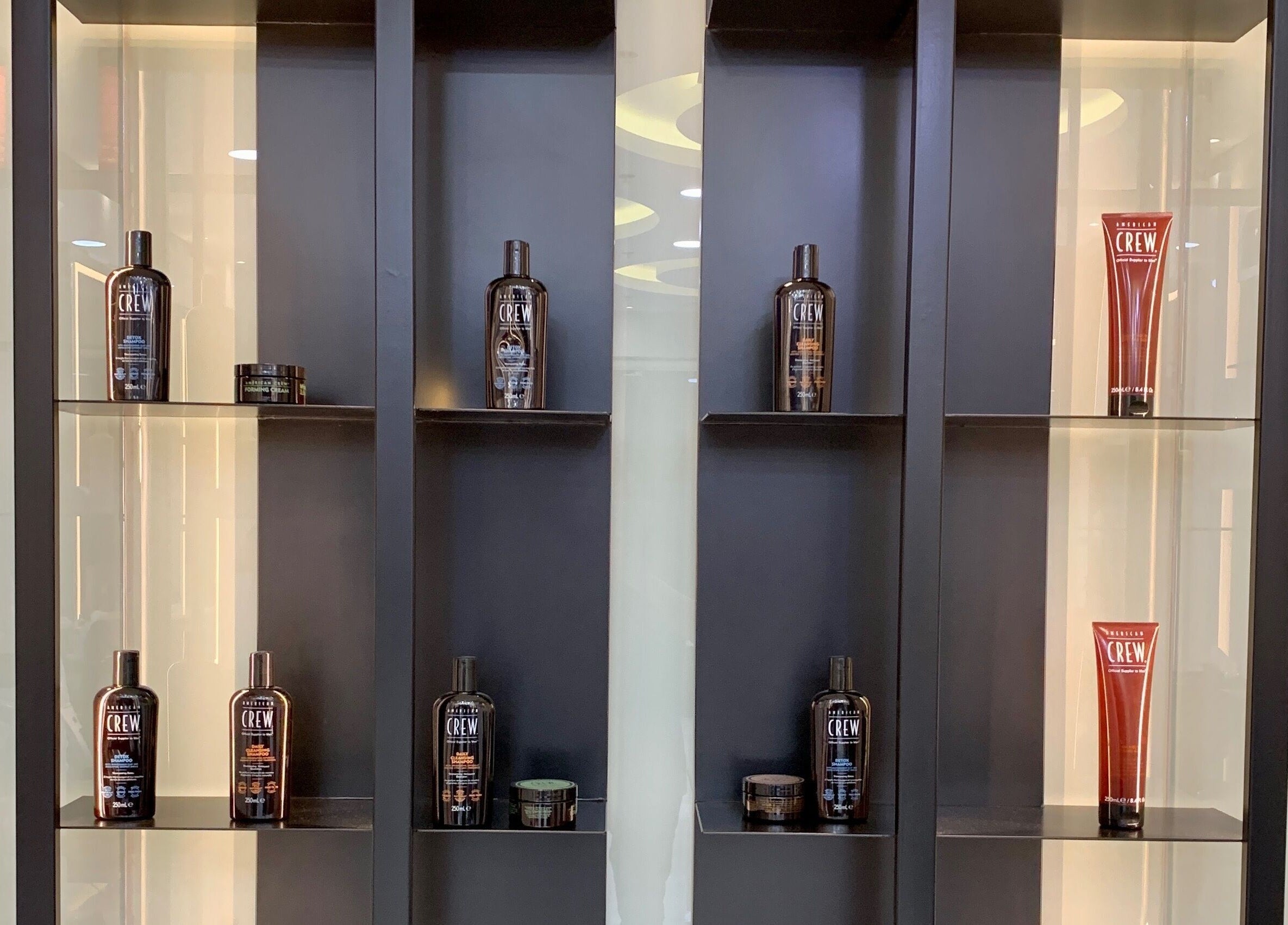 Display of grooming products at Aleph Gents Salon DMCC, Dubai, AE showcasing premium hair care.