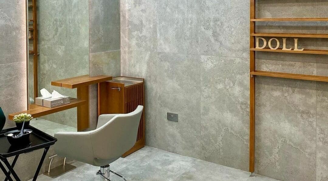Modern beauty station at Dolled Up Ladies Beauty Salon, Abu Dhabi, AE with stylish chair and minimalist decor.