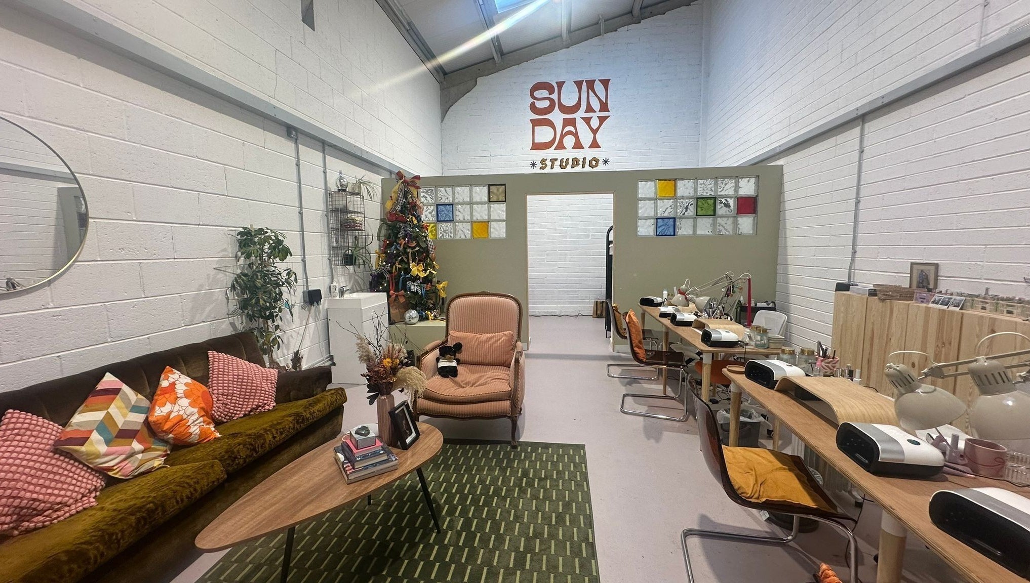Stylish Sun Day Studio in Truro, England, GB with cozy seating and vibrant decor.