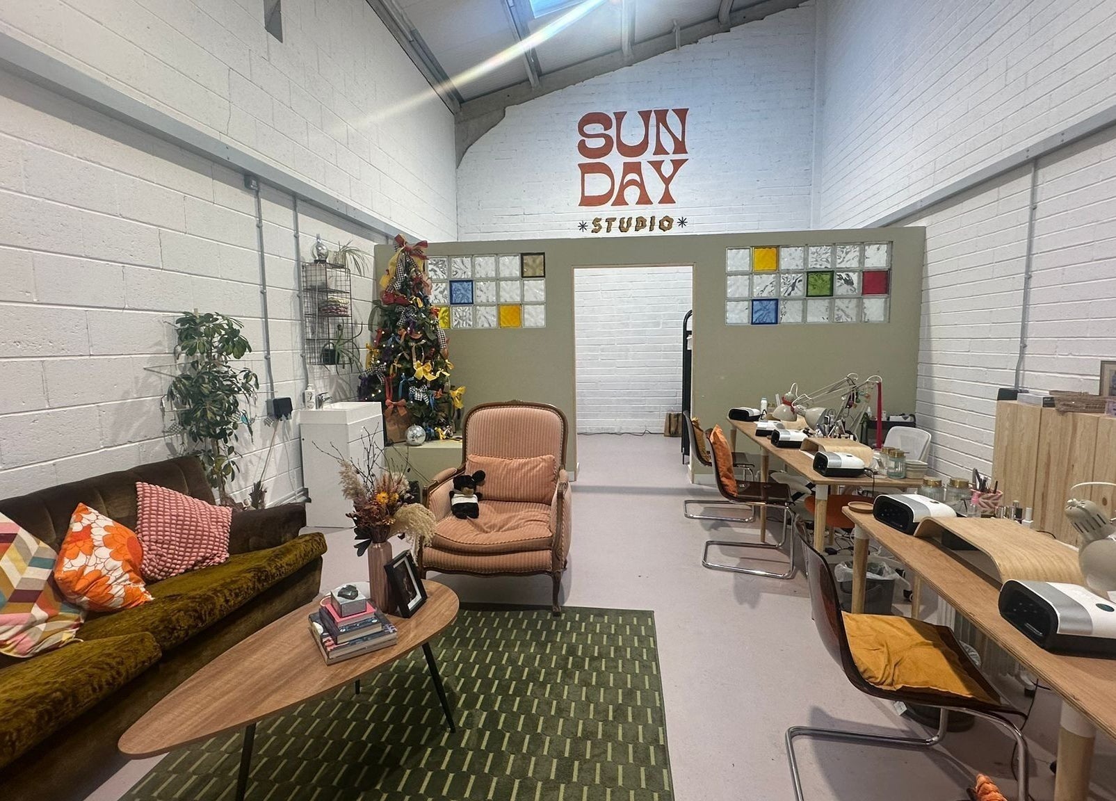 Stylish Sun Day Studio in Truro, England, GB with cozy seating and vibrant decor.