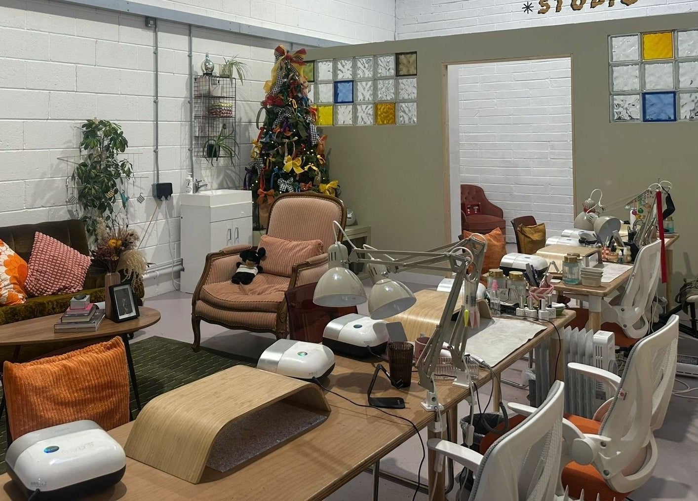 Elegant nail studio in Sun Day Studio, Truro, England, GB with cozy seating and vibrant decor.