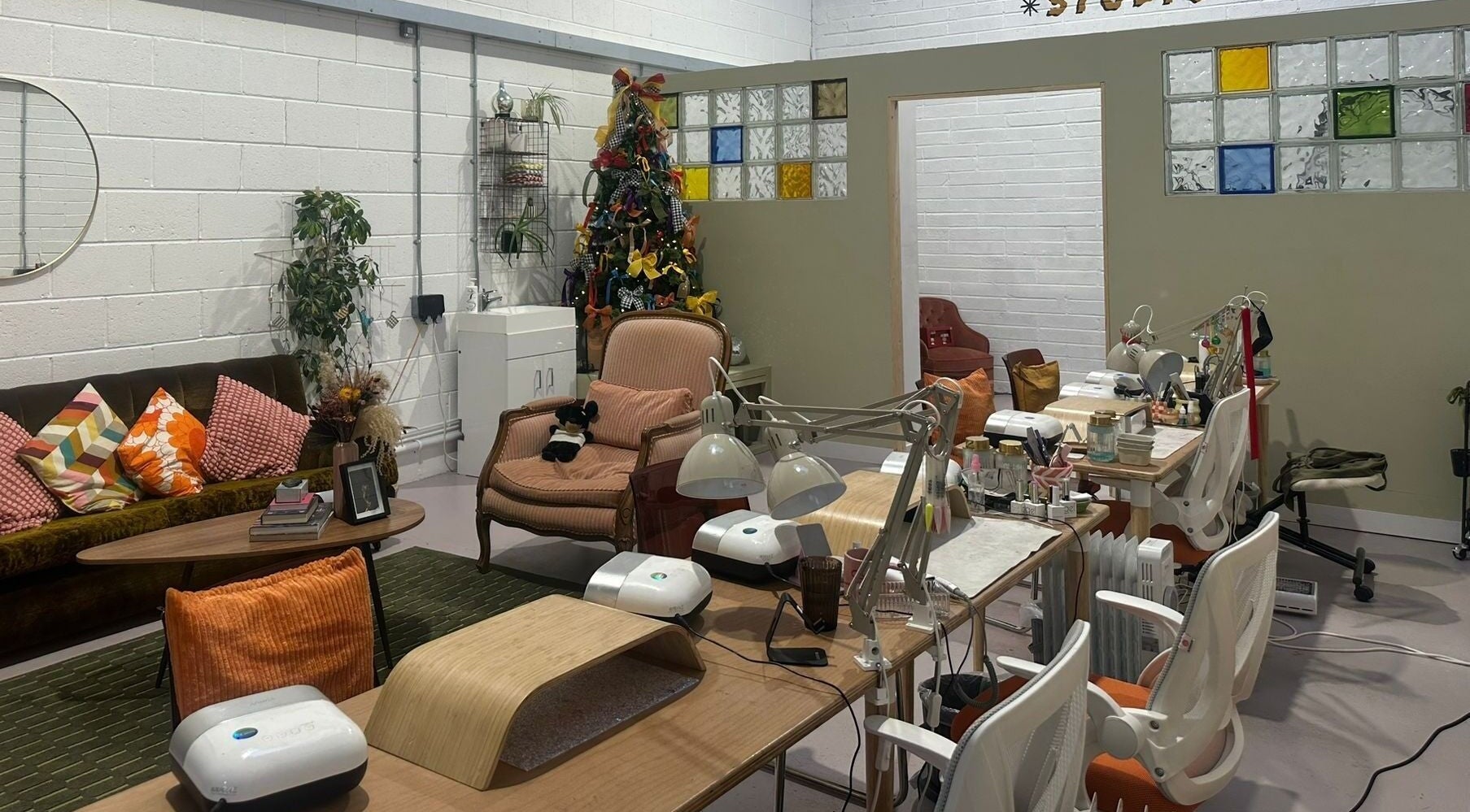 Elegant nail studio in Sun Day Studio, Truro, England, GB with cozy seating and vibrant decor.