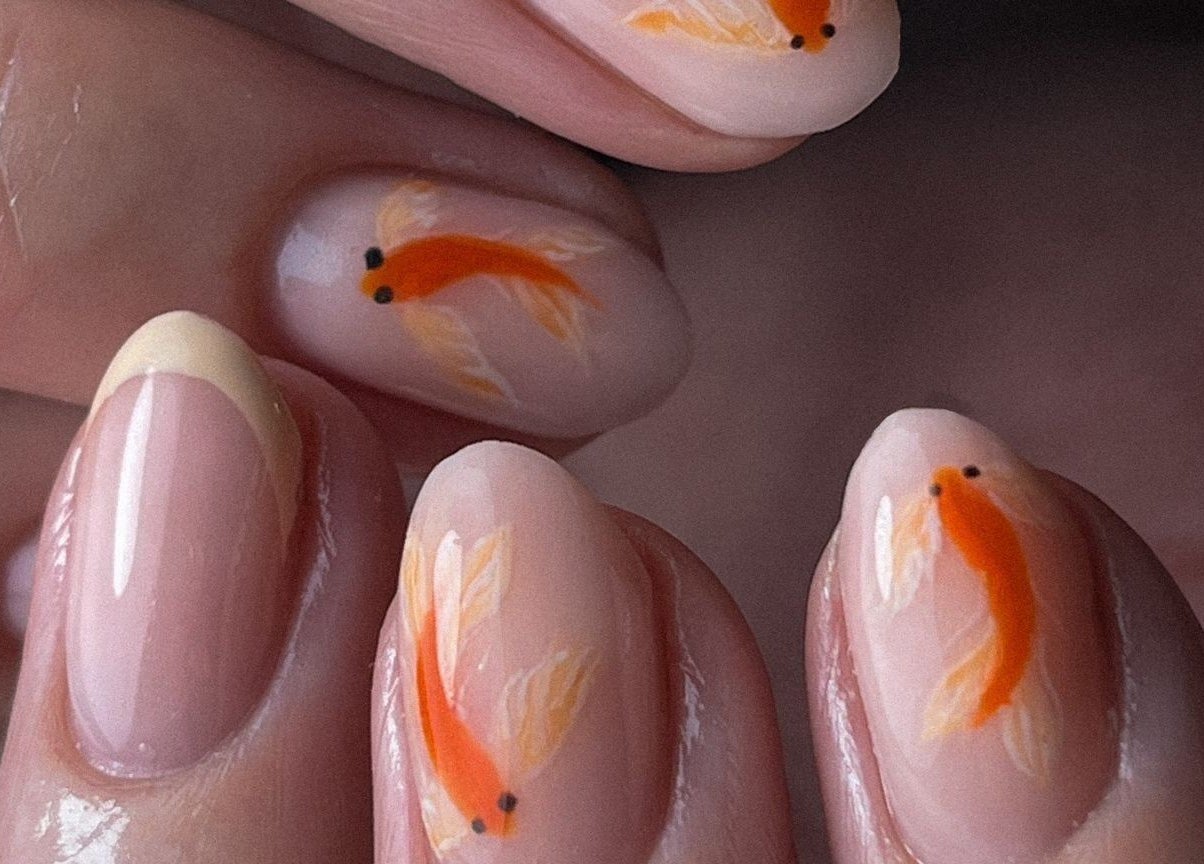 Elegant nail art featuring koi fish at Sun Day Studio, Truro, England, GB.