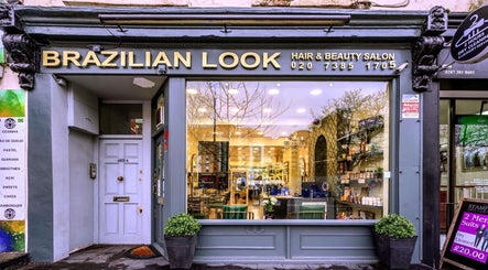 Chic beauty salon facade of Mr M’s in London, England, GB showcasing elegant services and modern design.