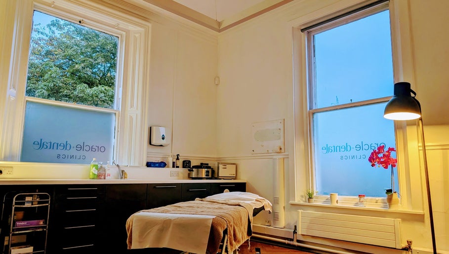 Peaceful therapy room at CL Body Therapy, Carlisle, England, GB with massage bed and warm lighting.
