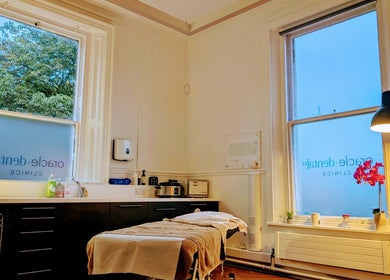 Peaceful therapy room at CL Body Therapy, Carlisle, England, GB with massage bed and warm lighting.