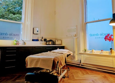 Serene treatment room at CL Body Therapy, Carlisle, England, GB with massage table and ambient lighting.