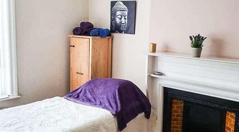 Serene therapy room at Crossgates Chiropody and Therapy Centre, Leeds, England, GB, featuring purple accents.