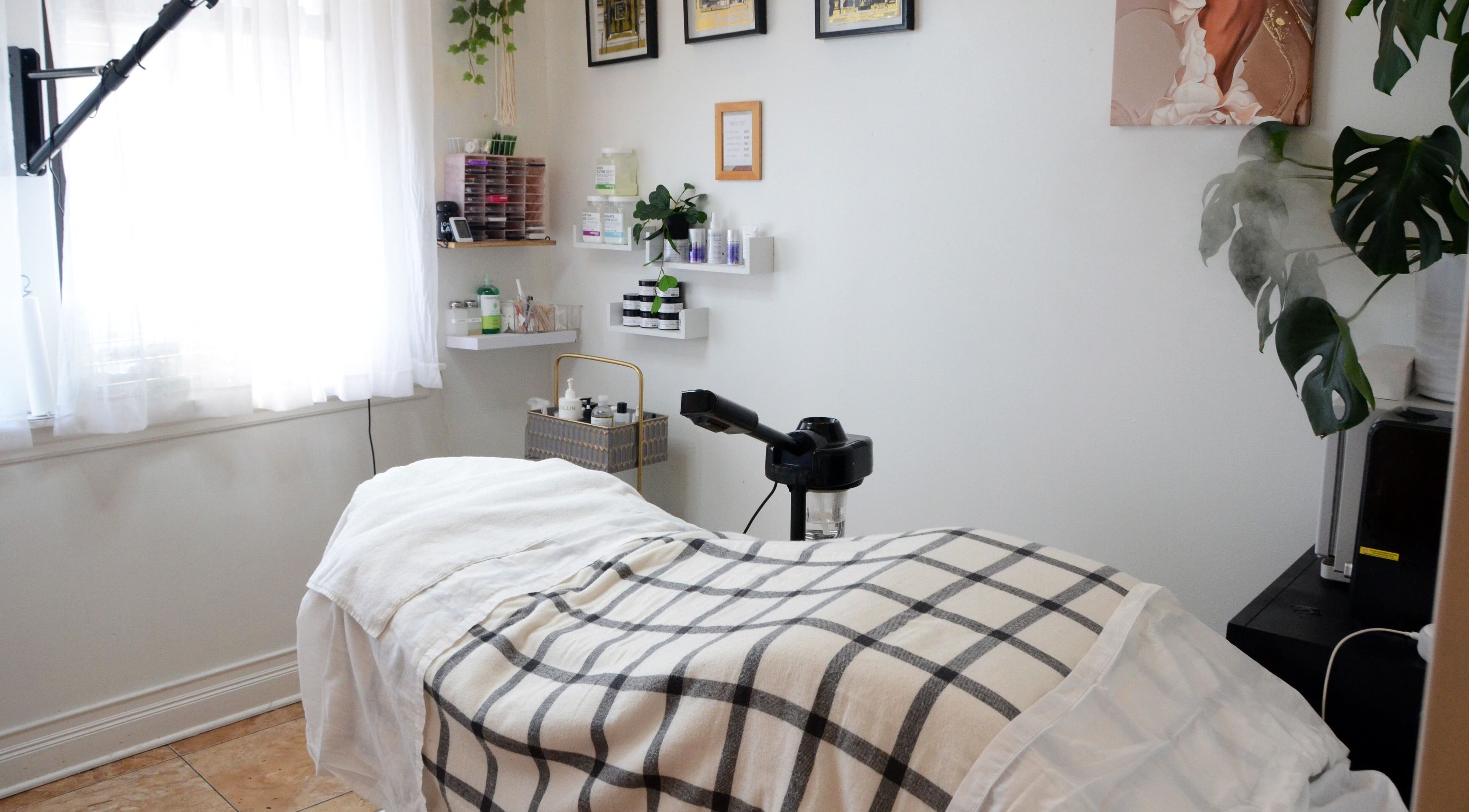 Cozy treatment room at Beauty Vibez Studio, Chicago, Illinois, US with a comfortable bed and serene decor.