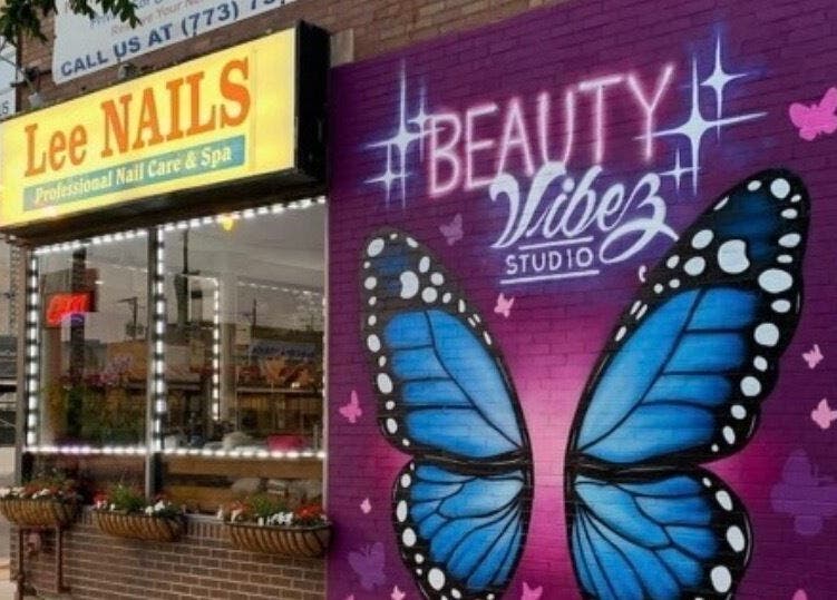 Colorful butterfly mural at Beauty Vibez Studio, enhancing its Chicago, Illinois, US storefront.