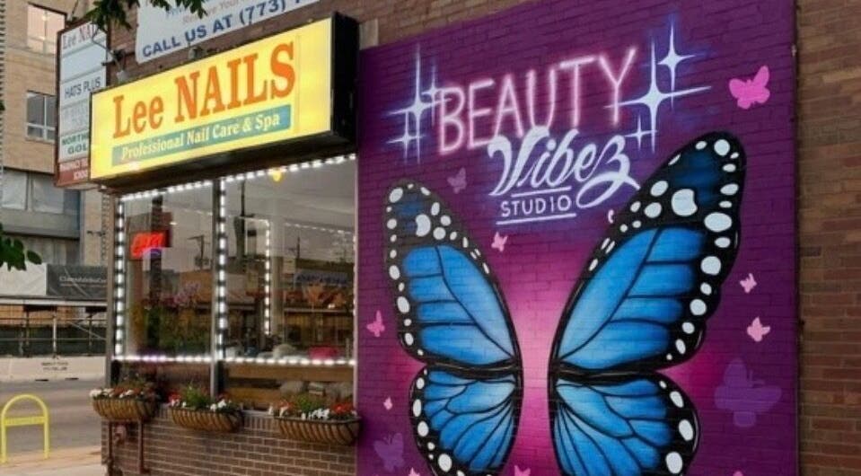 Colorful butterfly mural at Beauty Vibez Studio, enhancing its Chicago, Illinois, US storefront.