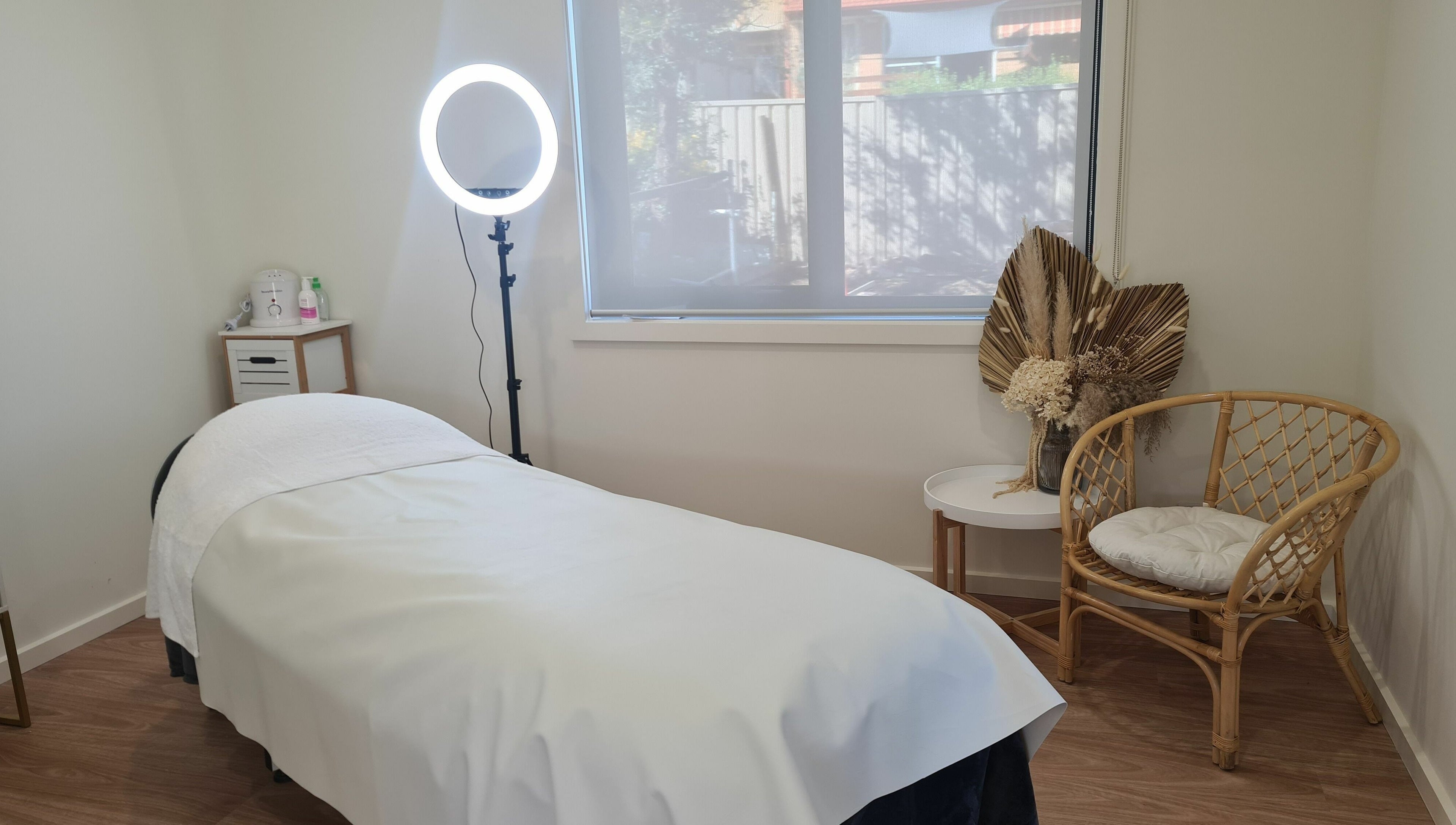 Relaxing treatment room at Baske Beauty Studio, Giralang, Australian Capital Territory, AU, with massage bed and decor.