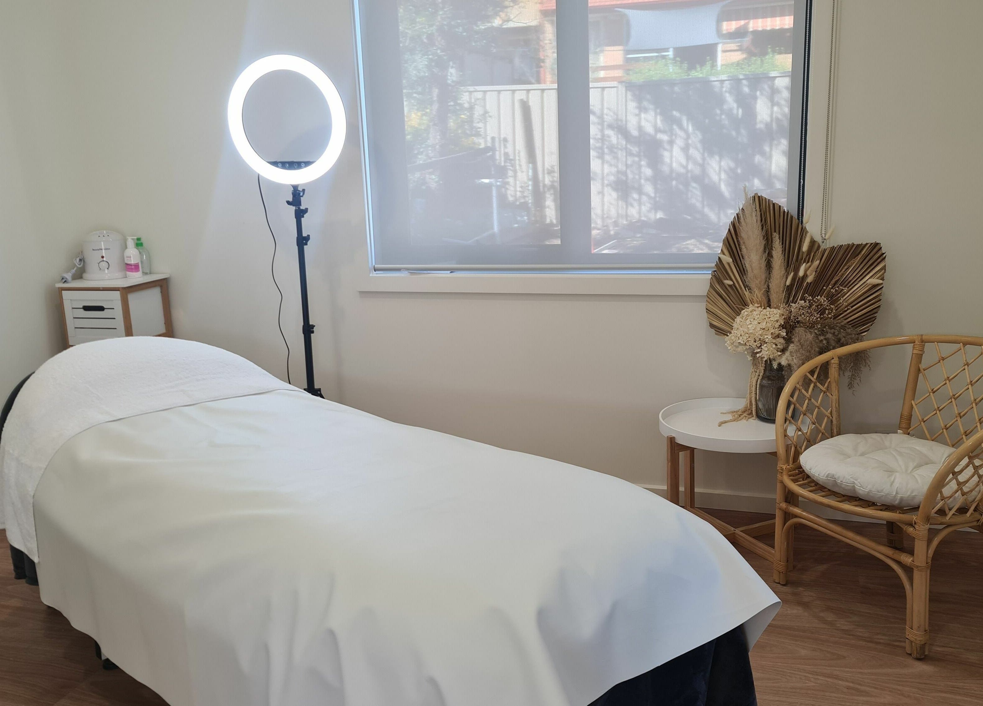 Relaxing treatment room at Baske Beauty Studio, Giralang, Australian Capital Territory, AU, with massage bed and decor.