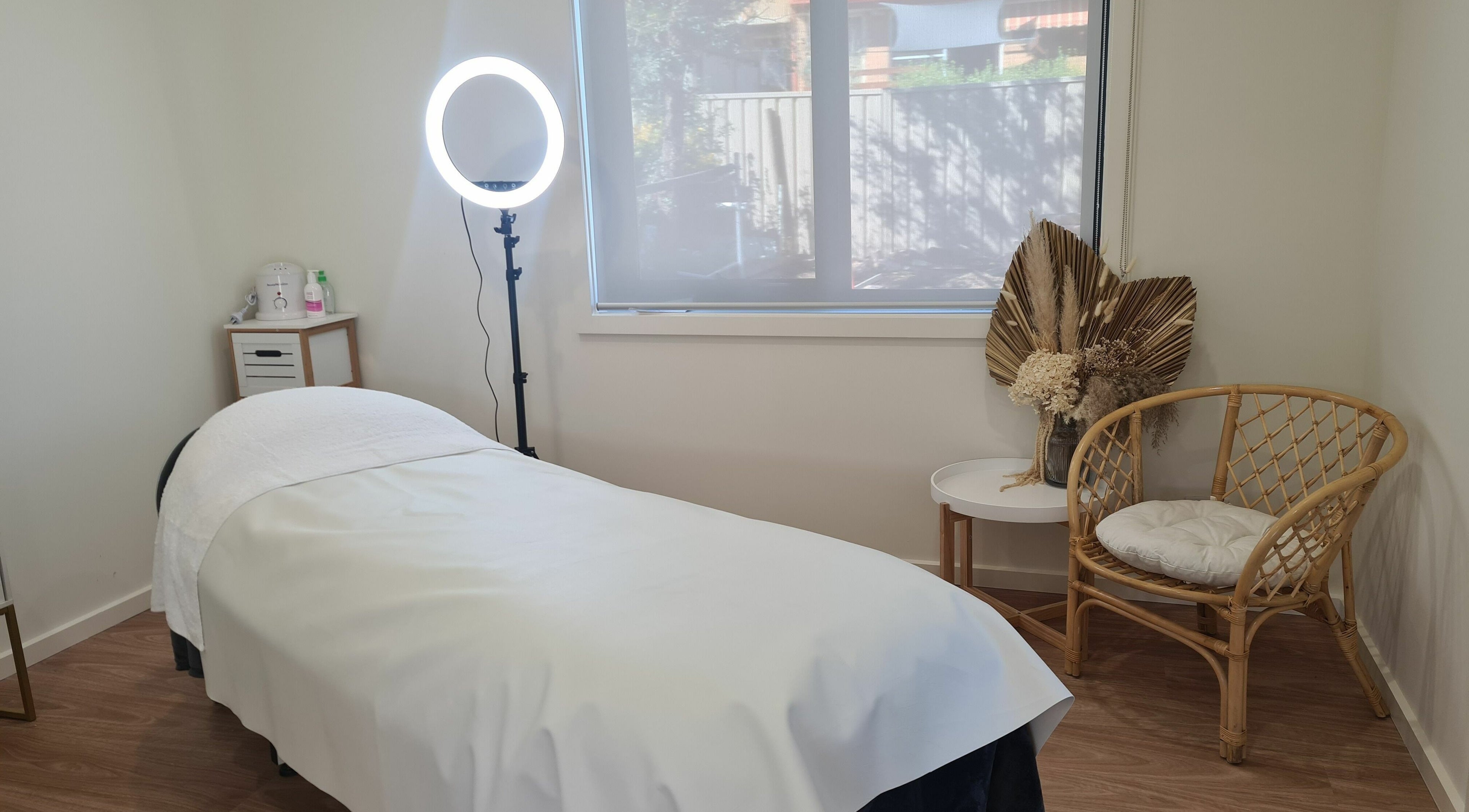 Relaxing treatment room at Baske Beauty Studio, Giralang, Australian Capital Territory, AU, with massage bed and decor.