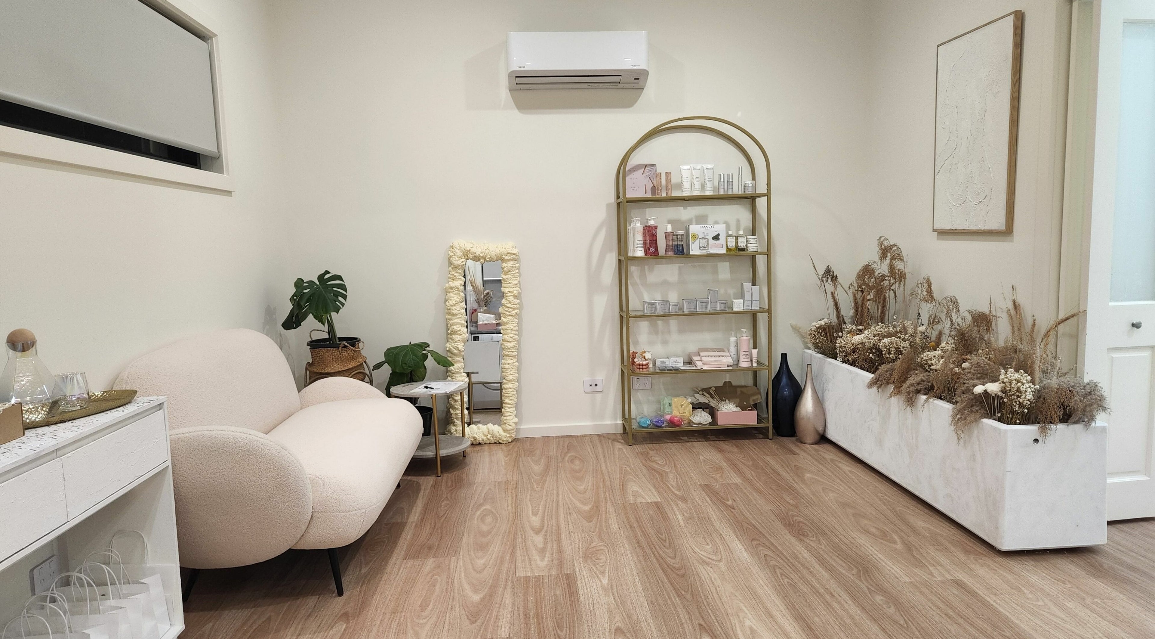 Cozy interior of Baske Beauty Studio, Giralang, ACT, AU featuring modern seating and elegant decor.