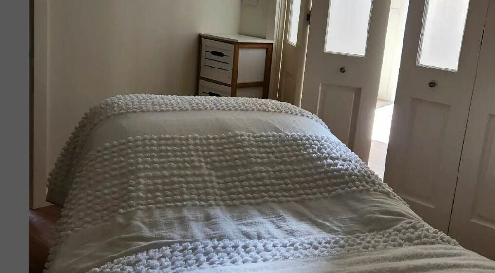 Relaxing treatment room at Baske Beauty Studio, Giralang, Australian Capital Territory, AU with soft lighting.