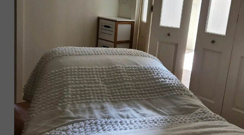 Relaxing treatment room at Baske Beauty Studio, Giralang, Australian Capital Territory, AU with soft lighting.