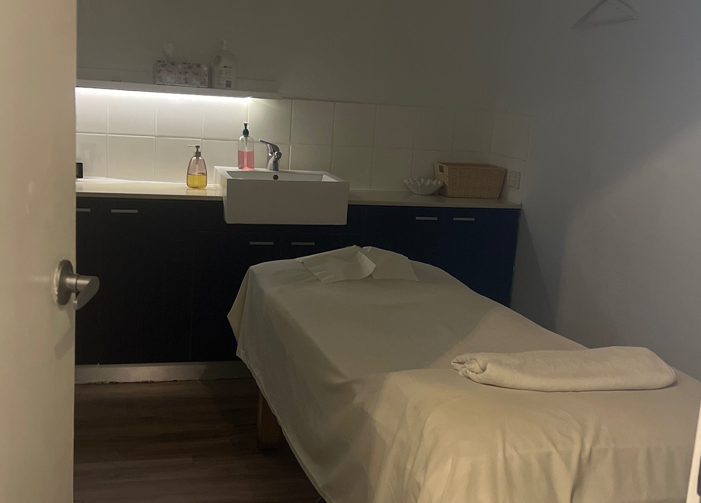 Relaxing massage room at Nee Massage | BICTON, located in Bicton, WA, AU, featuring a cozy massage bed.