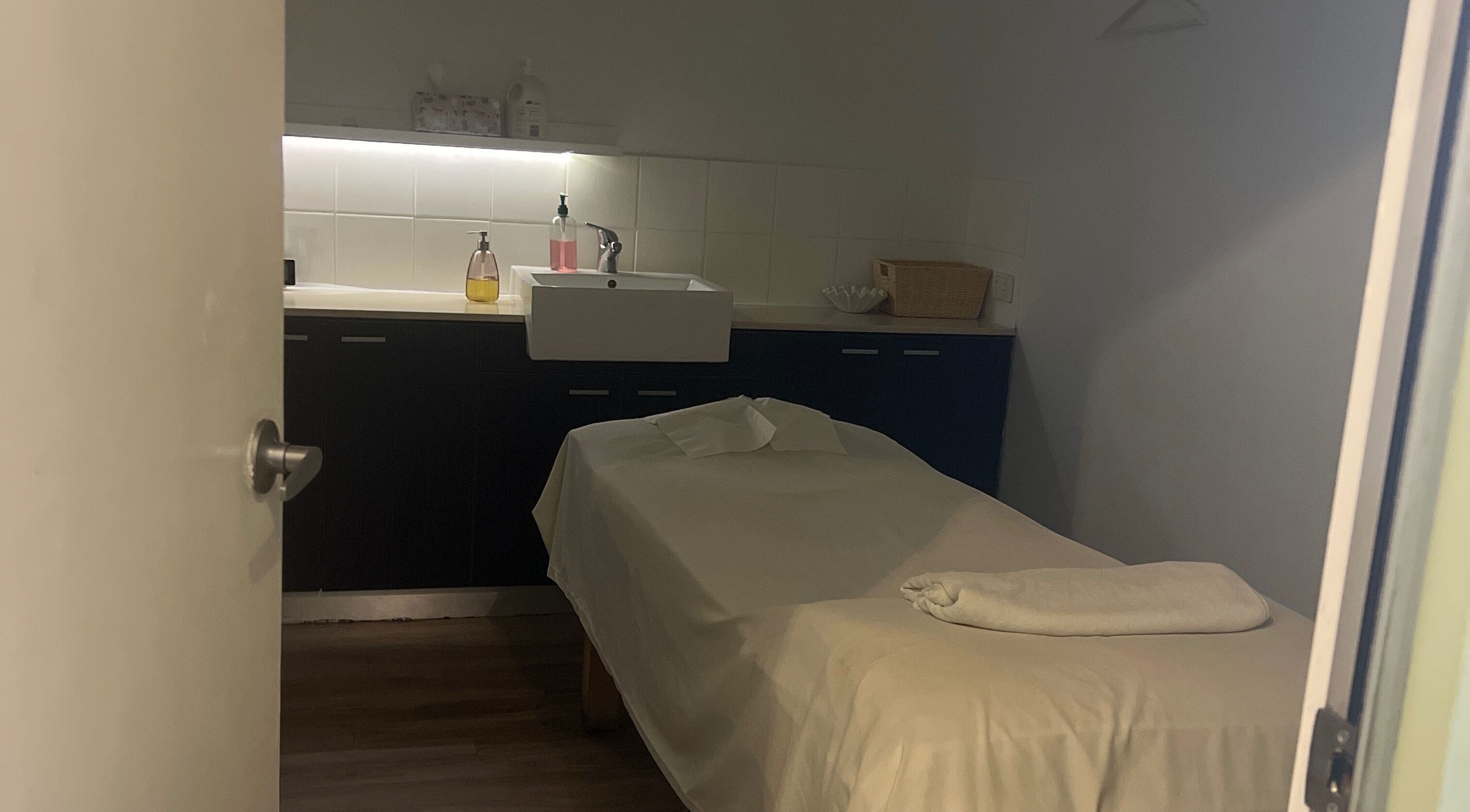 Relaxing massage room at Nee Massage | BICTON, located in Bicton, WA, AU, featuring a cozy massage bed.