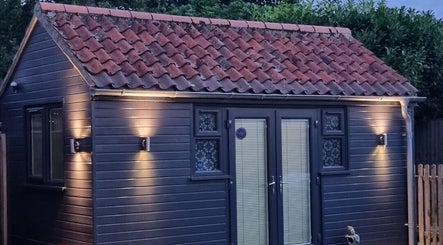 Charming exterior of Sophie's Glitz Nails & Beauty Salon, Attleborough, England, GB, offering a serene ambiance.