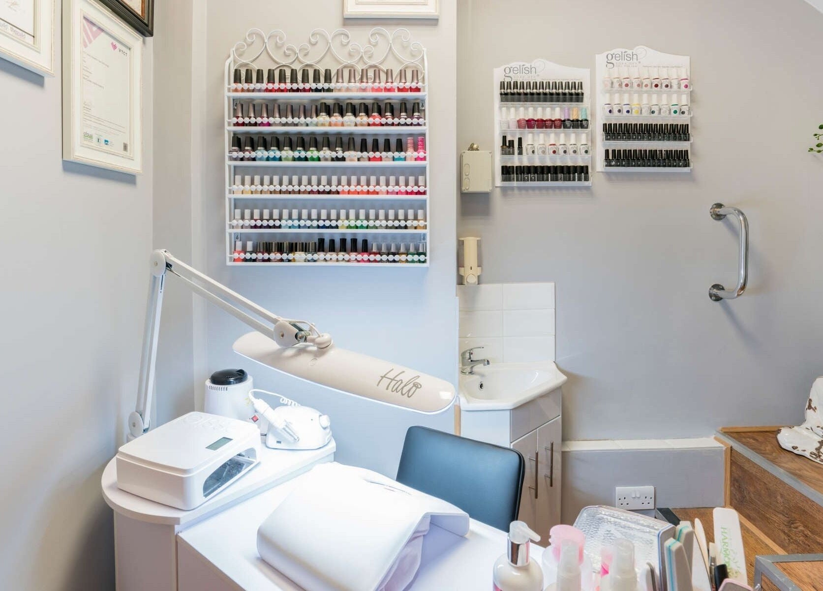Nail care station at Beauty Spot by NP (Remix Salon), London, England, GB, with organized polish display.